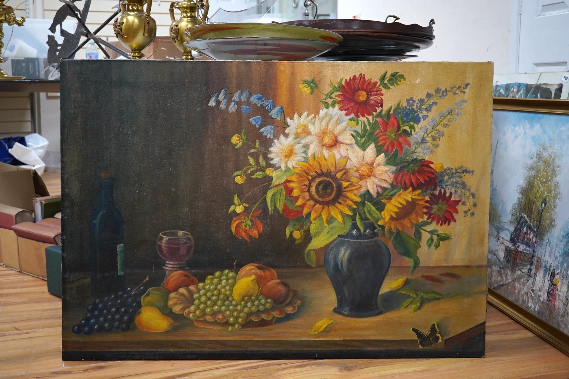 K. Hohberger, mid 20th century, oil on canvas, Still life of flowers and fruit, signed and dated 1947, 77 x 110cm, unframed. Condition - fair